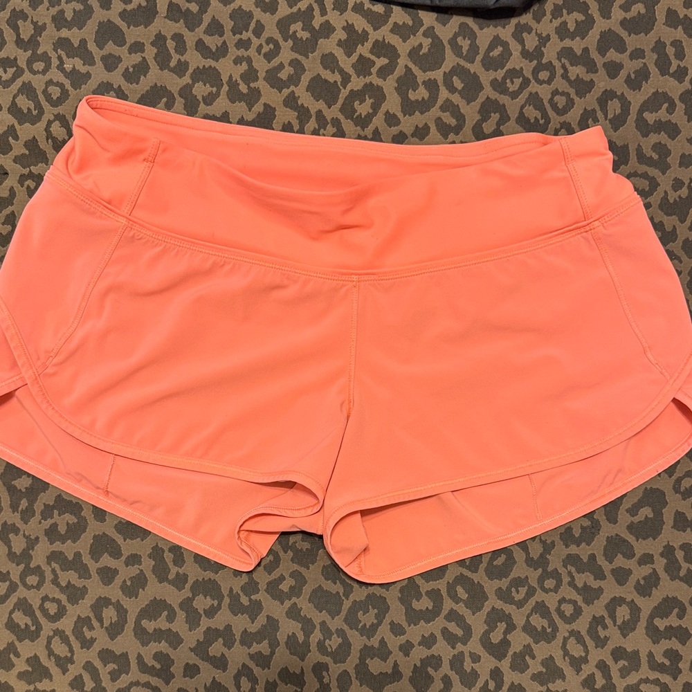 Lululemon 2.5-inch Speed Up shorts bright coral color